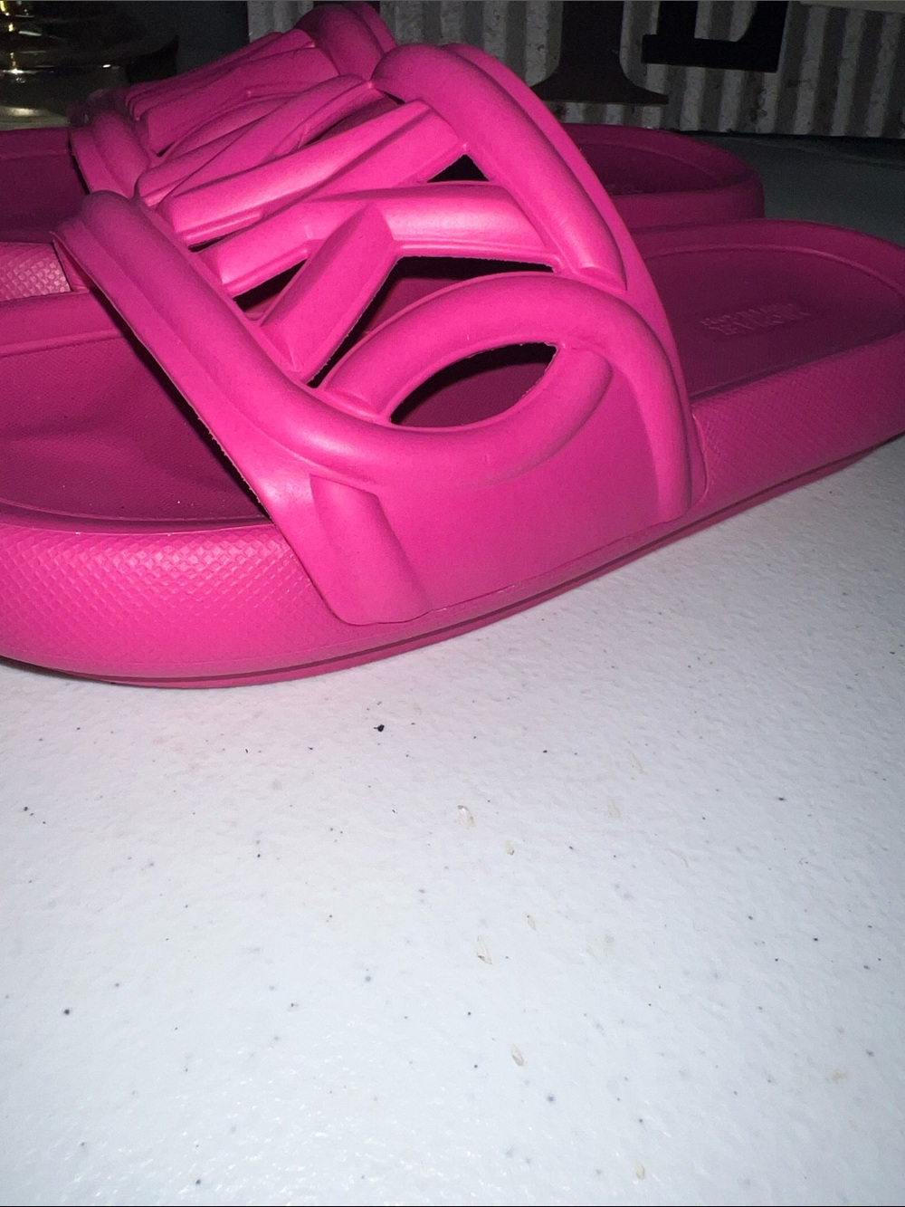 Michael Kors Splash Slide sandals in a bright cerise pink color. - Picture 6 of 6